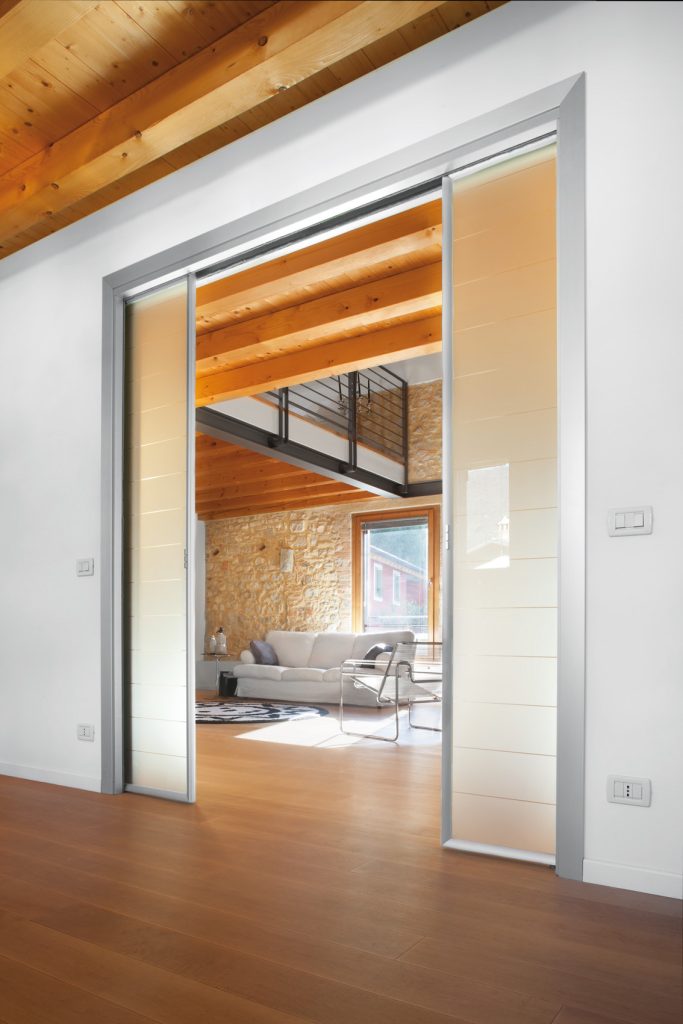 Porte coulissante double vantaux Extension avec porte en verre et aluminium